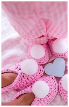 Pink slippers with a pompom