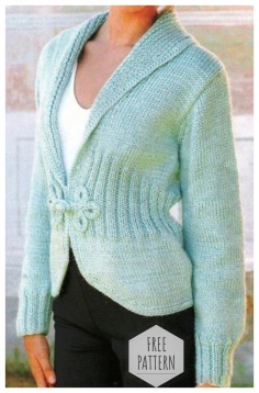 Fitted soft blue jacket with knitting needles