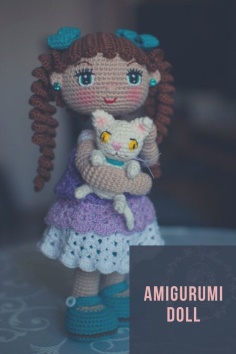 Crocheted doll with a kitten crochet